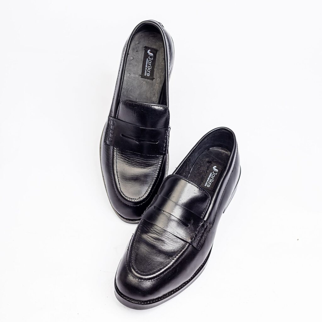 Jarikre black penny loafers for men on white background