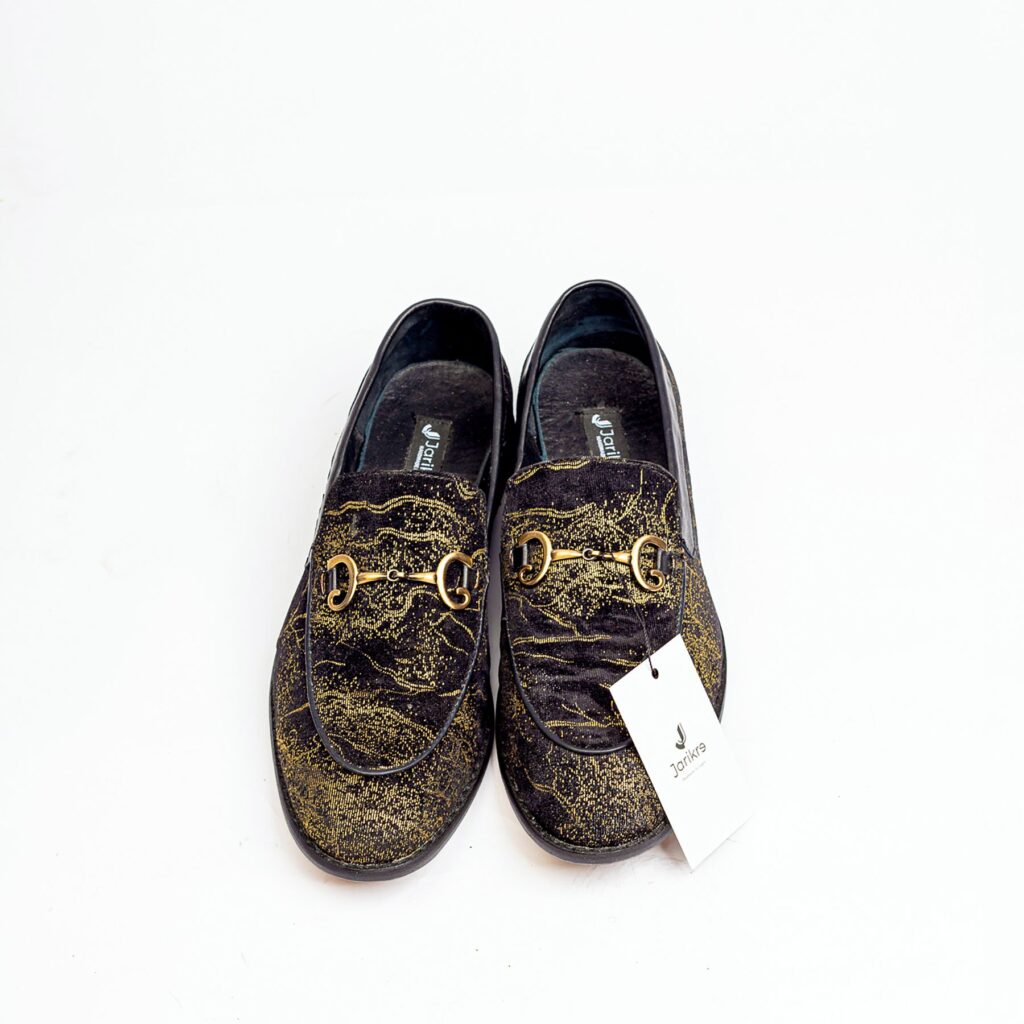 Jarikre black and gold horsebit loafers for men on white background
