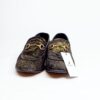 Jarikre black and gold horsebit loafers for men on white background
