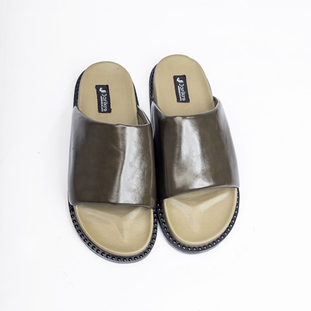 Jarikre olive leather slides for men on white background